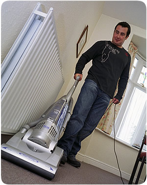 Man doing the vacuuming