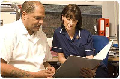 Discussion between a carer and member of NHS staff