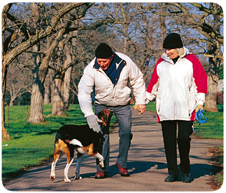 Couple out walking with dog