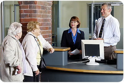 Two ladies waiting at a GP's reception