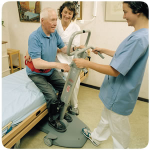 Man with two carers using transfer turner